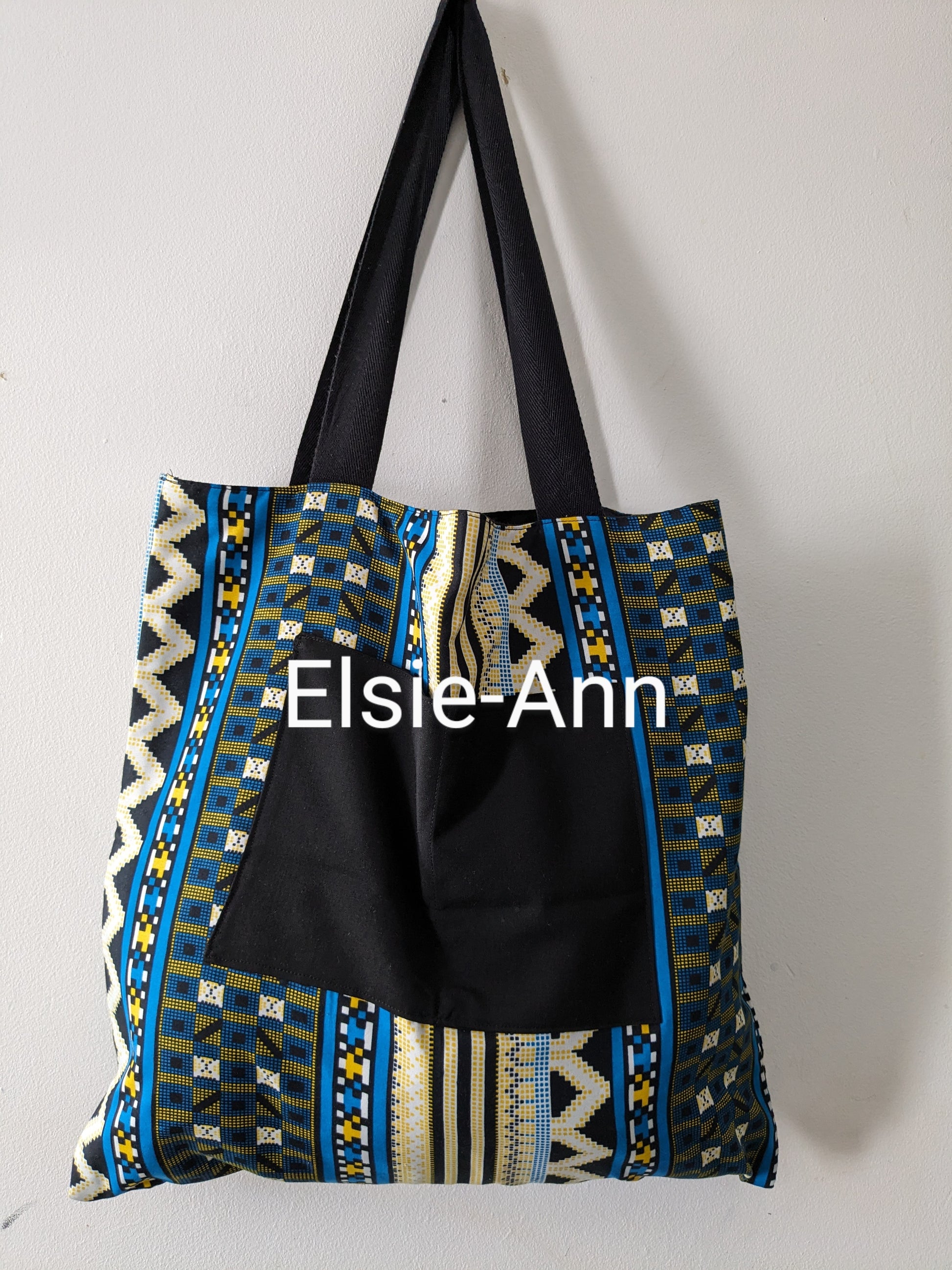 Lined turquoise blue, yellow and black  tote bag with matching earrings