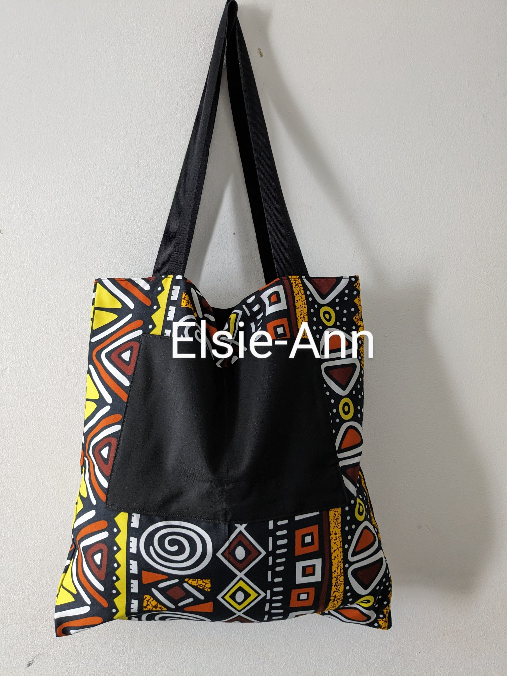 Lined brown black and yellow tote bag with matching earrings