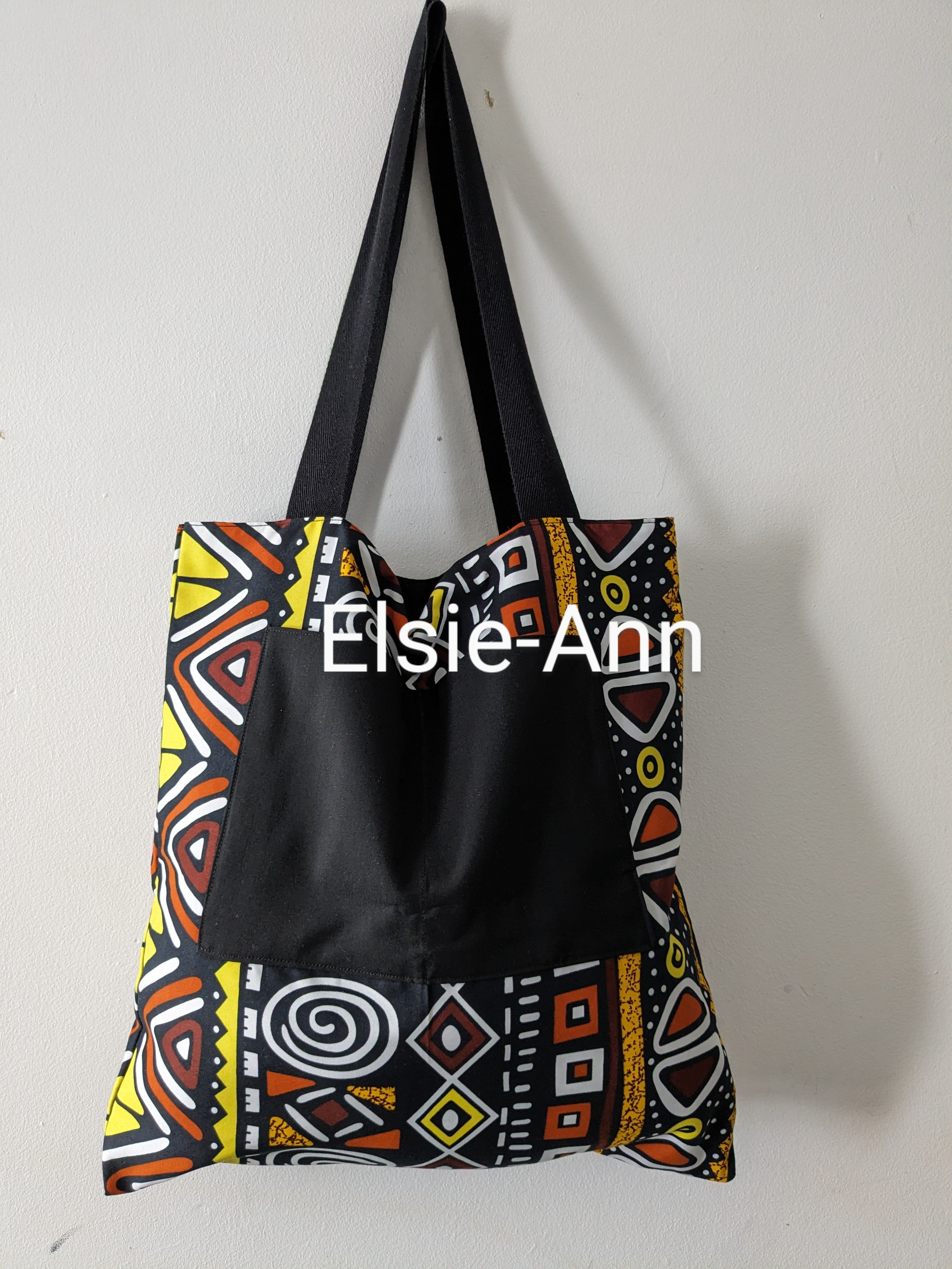 Lined brown black and yellow tote bag with matching earrings